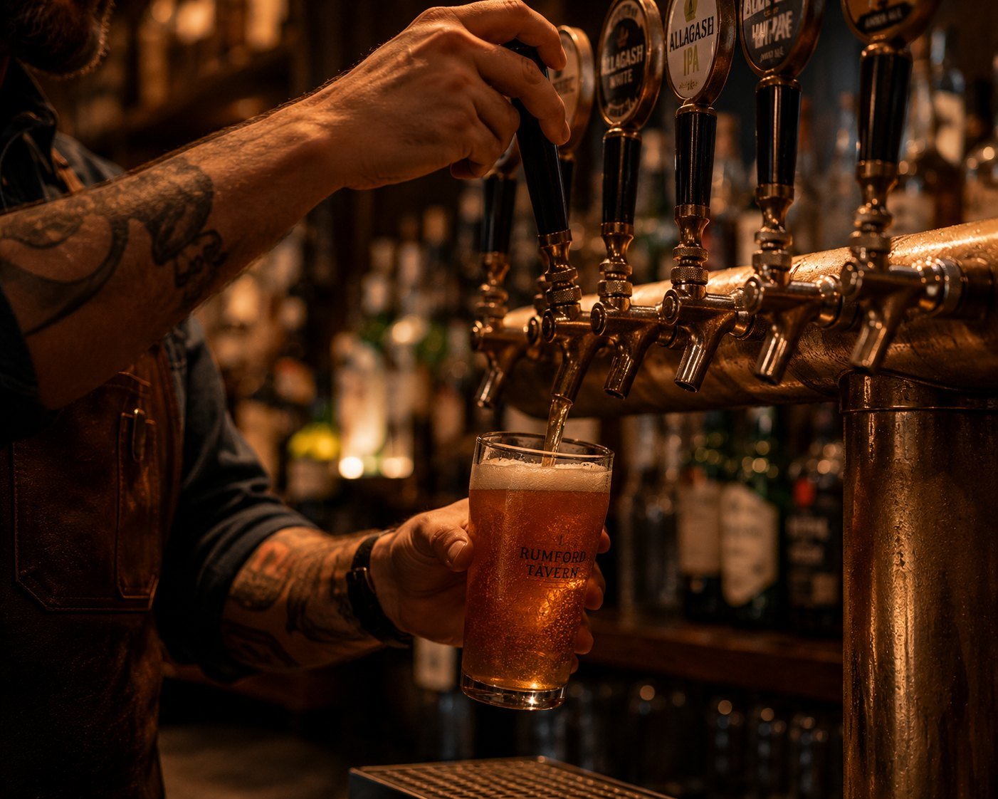 A bartender pouring a draft beer at the tavern