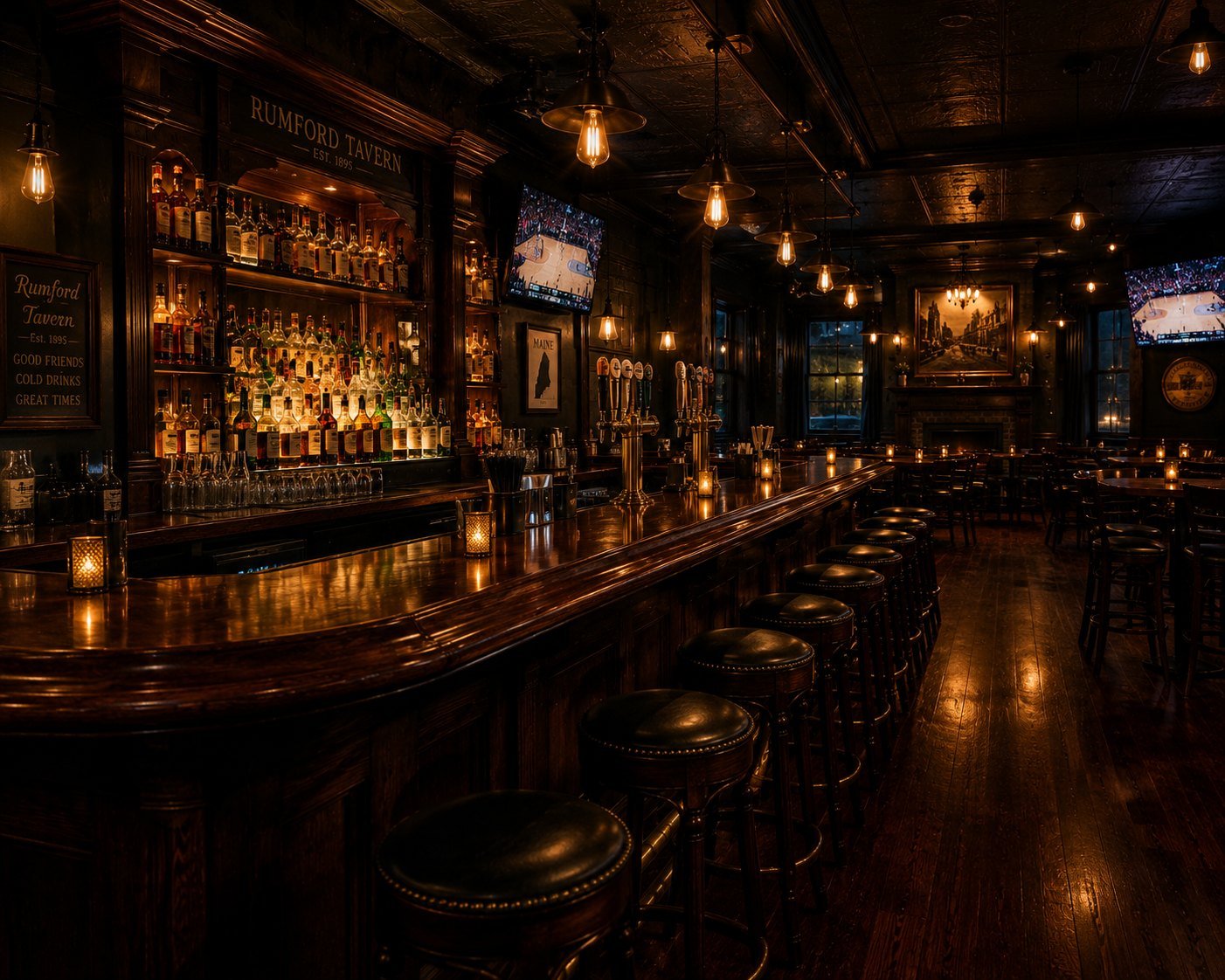 The historic tavern bar at Hotel Rumford glowing at night